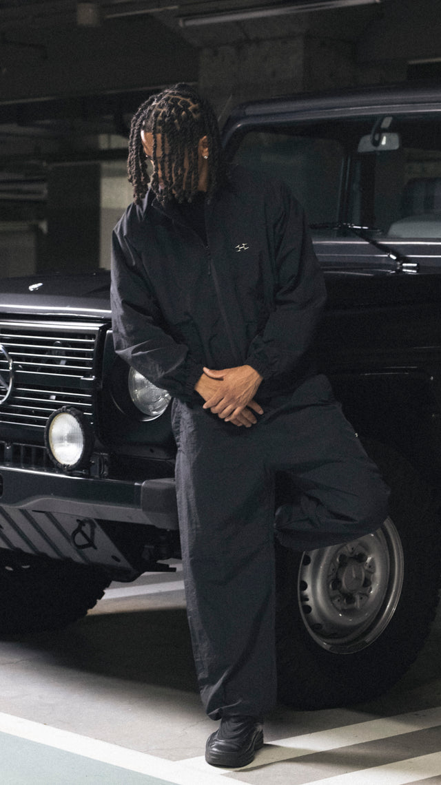 LOGO CHARM NYLON PANTS BLACK